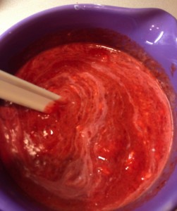 Stirring strawberry yogurt