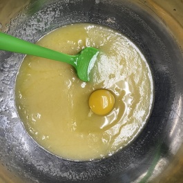 mixing eggs into wet ingredients